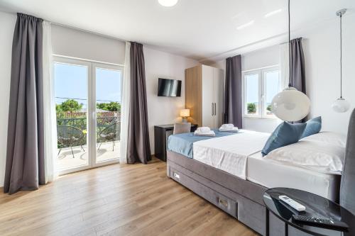 Postel nebo postele na pokoji v ubytování Villa Renesansa