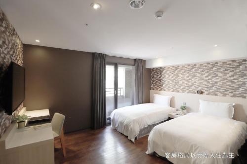 Postel nebo postele na pokoji v ubytování Talmud Hotel Yizhong