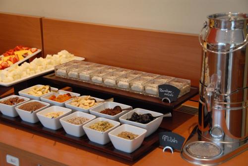 a buffet of different types of food on a table at relexa hotel Stuttgarter Hof in Berlin