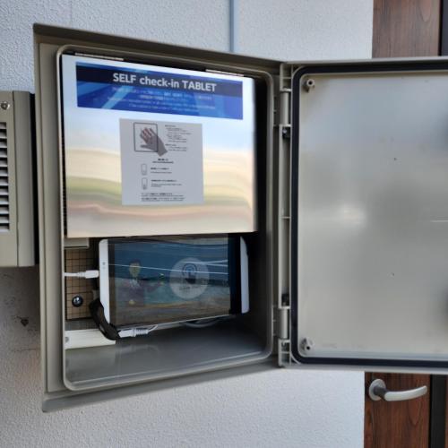 a door to a self check in ticket machine at 3ベッド3バス ヴィラアパラギ宮古島 in Miyako Island