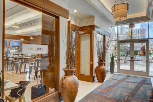 a store with two large vases in a room at Premium Suite MGM Signature HIGH FLR Balcony Strip View in Las Vegas