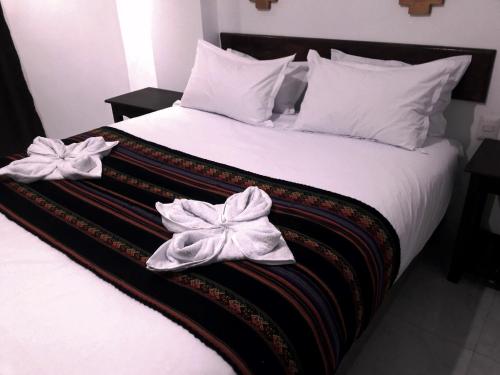 Llit o llits en una habitació de PAKARINA HOTEL