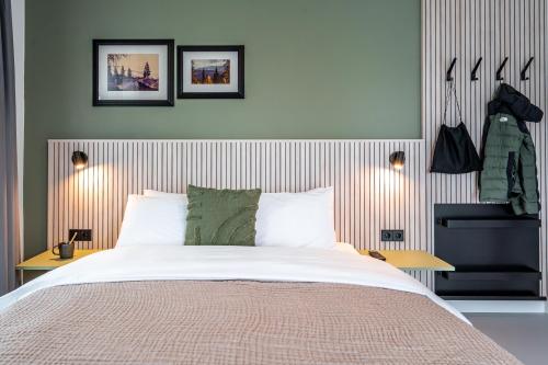 a bedroom with a large bed and two tables at stuub hinterzarten in Hinterzarten