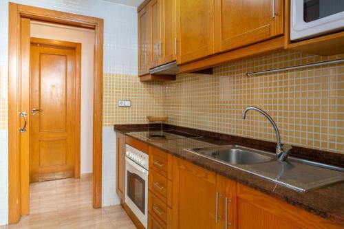 a kitchen with a sink and a counter top at Apolo66-3 in Torrevieja