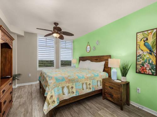 a bedroom with a bed and a ceiling fan at Lovers Key Resort 601 in Fort Myers Beach