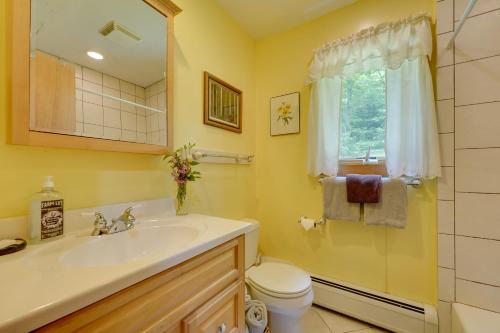 A bathroom at Riverfront Vermont Vacation Rental with Hot Tub