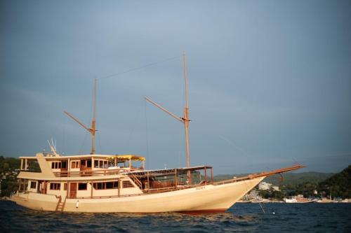 a boat is sitting in the water at Family labuan bajo in Labuan Bajo