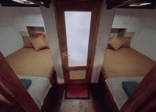 an overhead view of a room with two beds at Family labuan bajo in Labuan Bajo