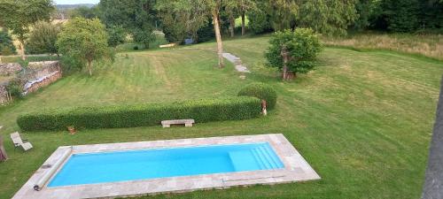 an aerial view of a yard with a swimming pool at Chambres d'hôtes La Babinerie in Saint-Léonard-de-Noblat