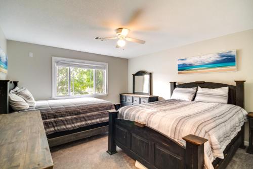 a bedroom with two beds and a window at Spacious Biloxi Home with Patio and Private Yard! in Biloxi