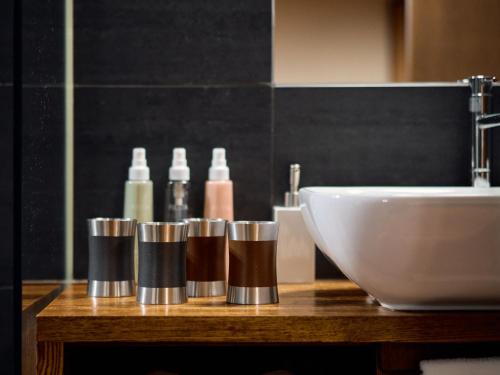 a bathroom counter with a sink and a white bowl at Kyoto Machiya Fukune in Kyoto