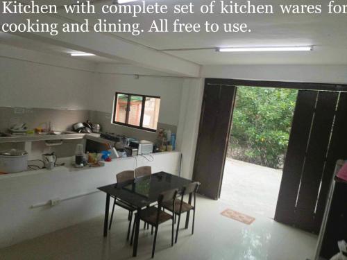 a kitchen with complete set of kitchen wares at CASA PRECIOSA MOALBOAL Inn in Moalboal