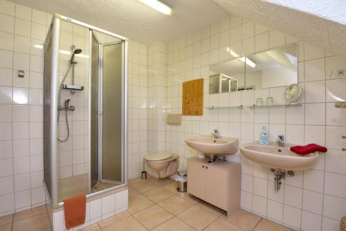 a bathroom with a shower and a sink and a toilet at Haus Cäcilie in Oberhof