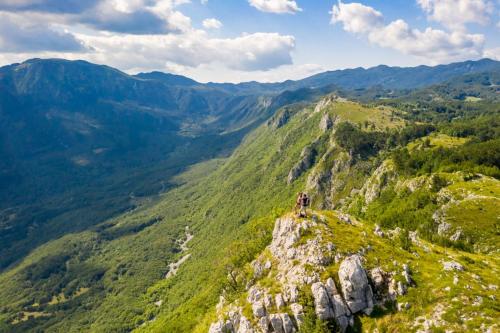 a person standing on top of a mountain at Pri Piskovih in Grgar
