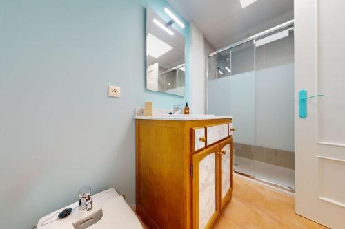 a bathroom with a sink and a mirror at Ático El Mar Mojácar- Marina de la Torre Res. Golf in Mojácar