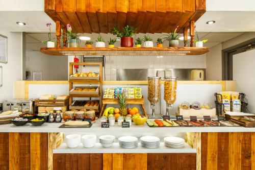 a kitchen with a buffet of food on a counter at ibis budget Sheffield Arena in Sheffield