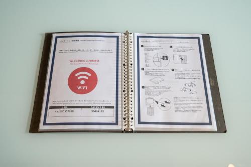 a framed picture of a wifi sign on a wall at Residence Hotel Hakata 8 in Fukuoka