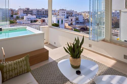 a living room with a view of a city at White Coast in Polignano a Mare