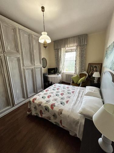 a bedroom with a large bed and a window at Contrada Cafaro in Salerno