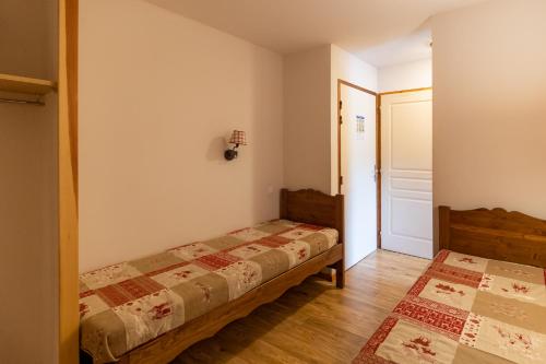 Cama ou camas em um quarto em Agence Des Orres - Les Mélèzes d'Or - T2 + Coin nuit - MZ2120