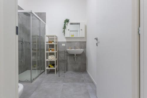 a bathroom with a sink and a shower at Borgo Panigale Viola Apartment in Bologna