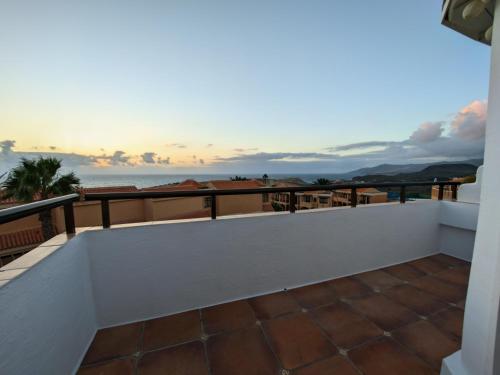 a view of the ocean from the balcony of a house at ISTMO - Quiet, Cosy Apartment with Panorama Sunset in La Pared