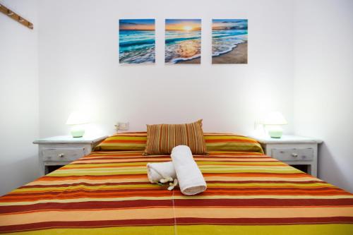 Posteľ alebo postele v izbe v ubytovaní Punta Prima Roma Planet Costa Dorada