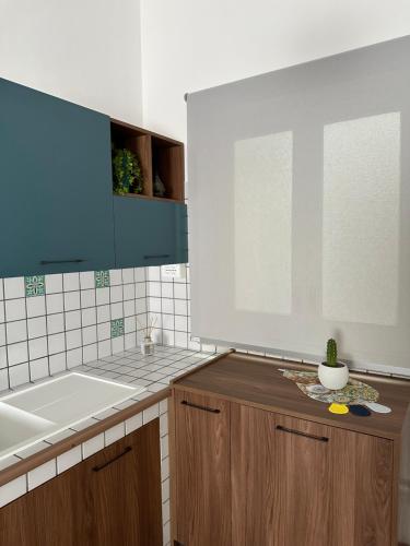 a kitchen with a sink and a counter top at Appartamento Sea La Vie in Custonaci