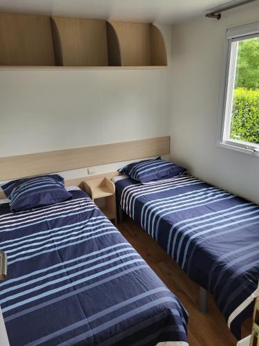 Katil atau katil-katil dalam bilik di Camping Ixtila mobilhome Betzüla