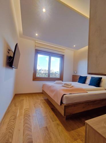 Кровать или кровати в номере Pino Silvestre II - Sir Oliver Apartman
