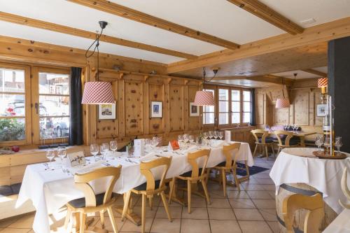 Un restaurante o sitio para comer en Hotel Posta