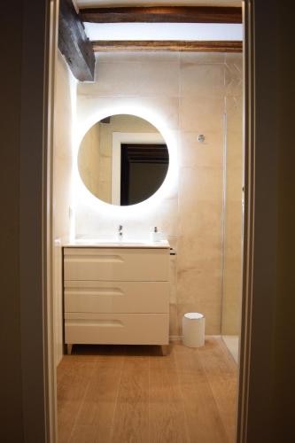 a bathroom with a sink and a mirror at Peritxenea Landa Apartamentuak in Lesaka