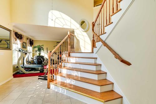 a staircase in a house with a gym at Woodsy Ballston Spa Home 4 Mi to State Park! in Ballston Spa