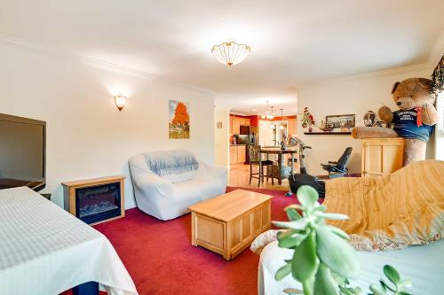 a living room with a teddy bear standing on the wall at Woodsy Ballston Spa Home 4 Mi to State Park! in Ballston Spa