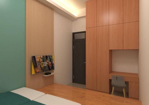 a bedroom with a bed and a desk and a chair at Beauty Chen's House in Tianwei