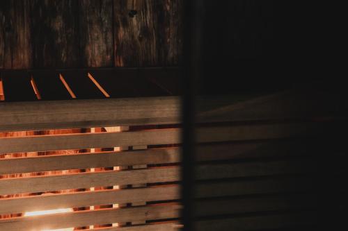 a close up of a wooden fence in a dark room at Hotell Lappland in Lycksele