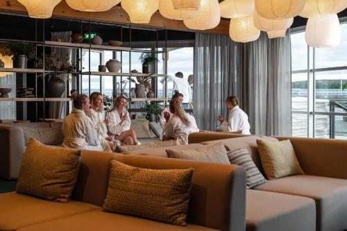 a group of women sitting in a room at Hotell Lappland in Lycksele