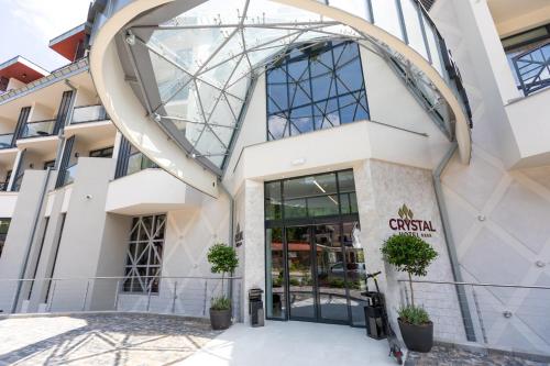 a view of the front of a building at HOTEL CRYSTAL WELLNESS & SPA superior in Sovata