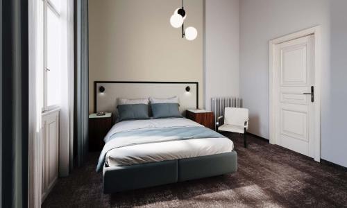 カルロヴィ・ヴァリにあるOREA Place Carlsbadのベッドルーム1室(大型ベッド1台、白いドア付)