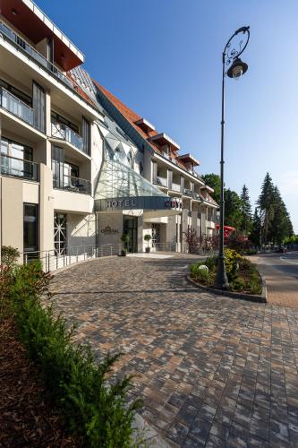 a street light in front of a building at HOTEL CRYSTAL WELLNESS & SPA superior in Sovata