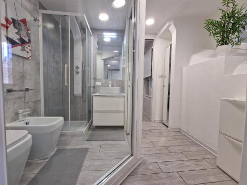 a bathroom with a shower and a sink and a toilet at Casa Mazzini in Turin