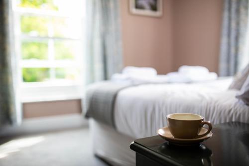 Ένα ή περισσότερα κρεβάτια σε δωμάτιο στο Woodfalls Inn
