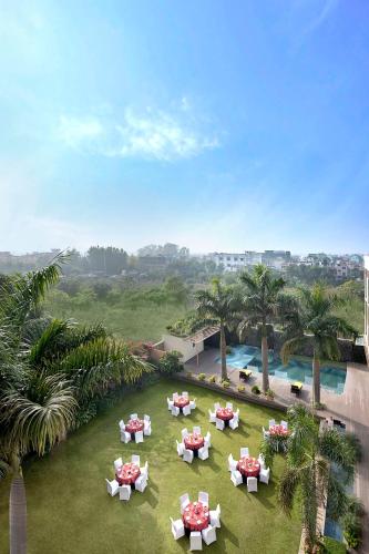 an overhead view of a lawn with tables and chairs at Country Inn & Suites By Radisson Jammu in Jammu