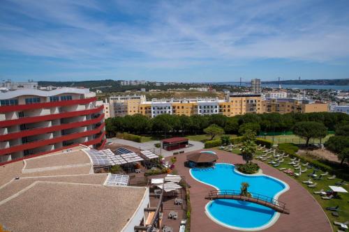 an aerial view of a resort with a swimming pool at MS Aparthotel in Linda-a-Velha