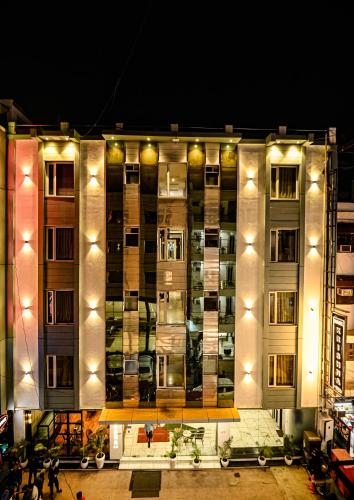 a large building with lights on it at night at Hotel Krishna Deluxe-By RCG Hotels in New Delhi
