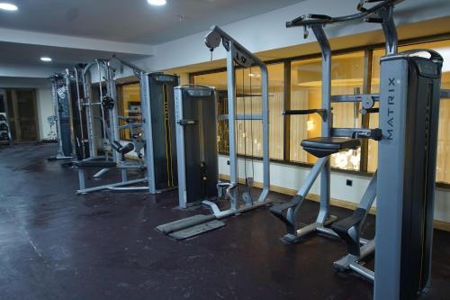 a gym with several tread machines in a room at Best Western Premier Dynasty in Addis Ababa