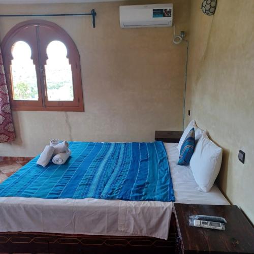 Una cama o camas en una habitación de Maison d´hôtes Amazir