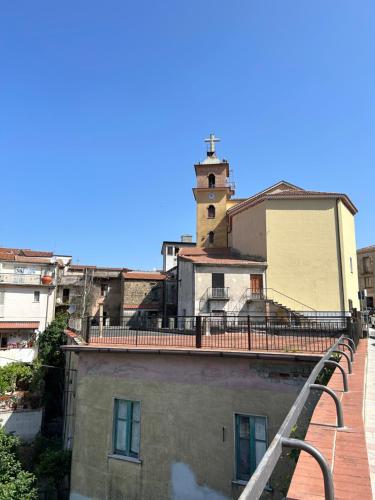 a building with a clock tower on top of it at Da Piero & Lilia in Centola