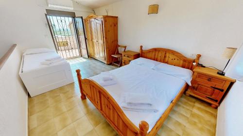 Postel nebo postele na pokoji v ubytování La Palmera