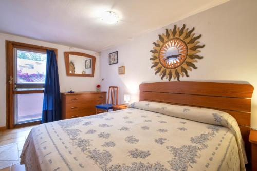 Säng eller sängar i ett rum på Casetta Brandinu